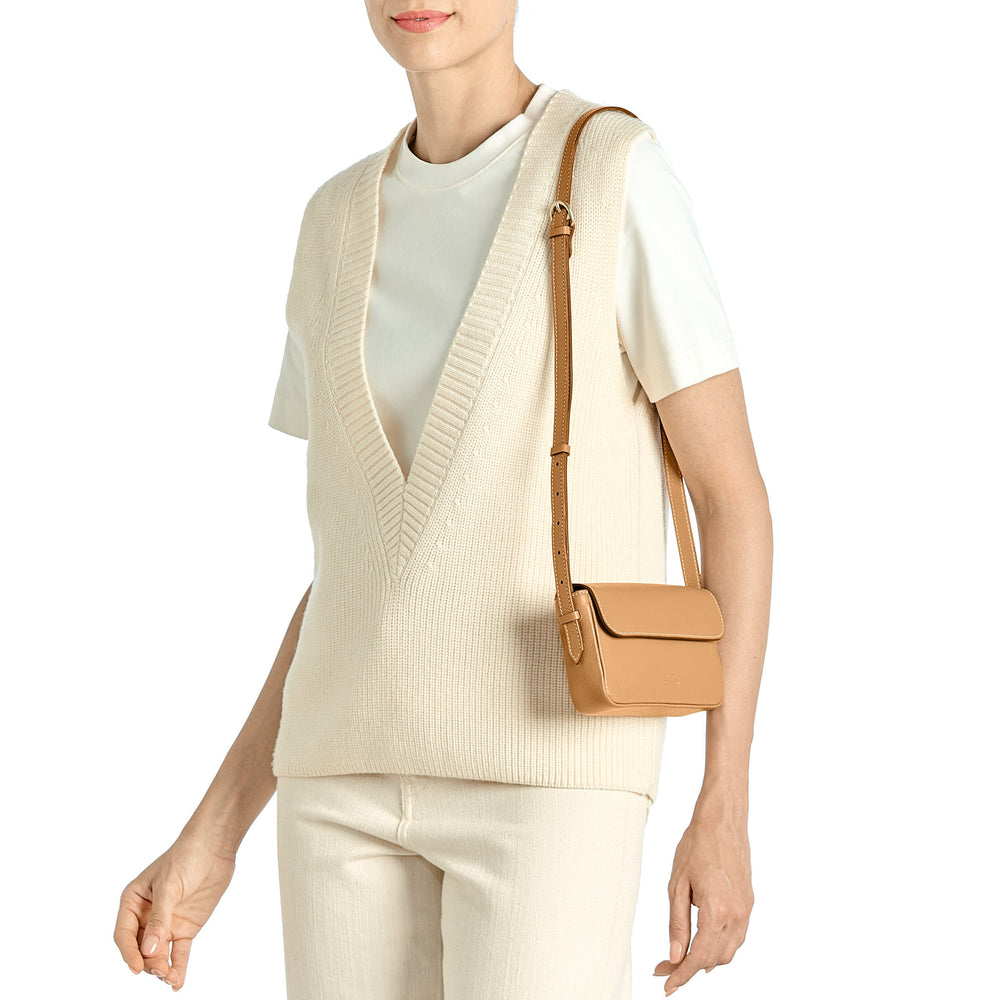 Studio | Women's crossbody bag in leather color gianduia — 
lifestyle view
 — 2 of 4