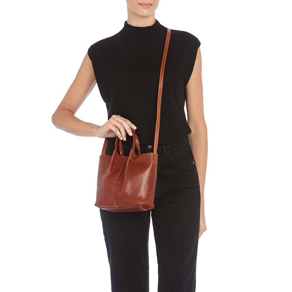 Nina | Women's crossbody bag in vintage leather color sepia — 
lifestyle view
 — 2 of 5