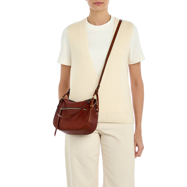 Essenza | Women's crossbody bag in vintage leather color sepia — 
lifestyle view
