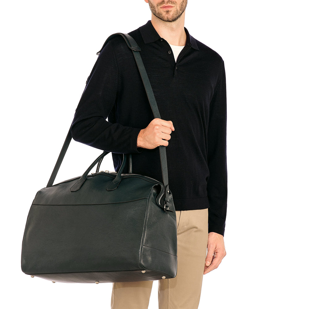 Archetipo | Men's travel bag in vintage leather color mezzanotte blue — 
lifestyle view
 — 2 of 4