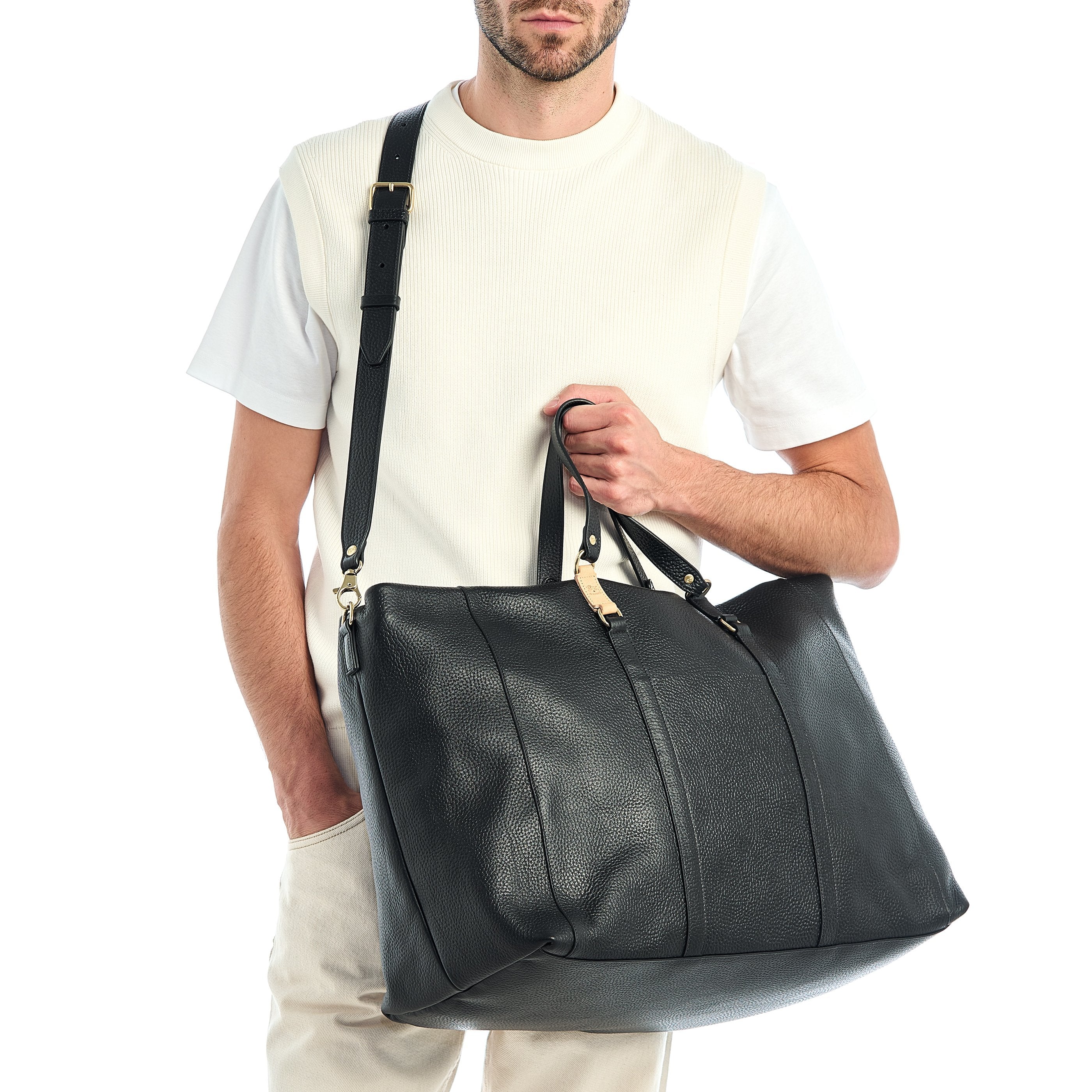 Segno | Men's travel bag in leather color black — 
lifestyle view
 — 2 of 7