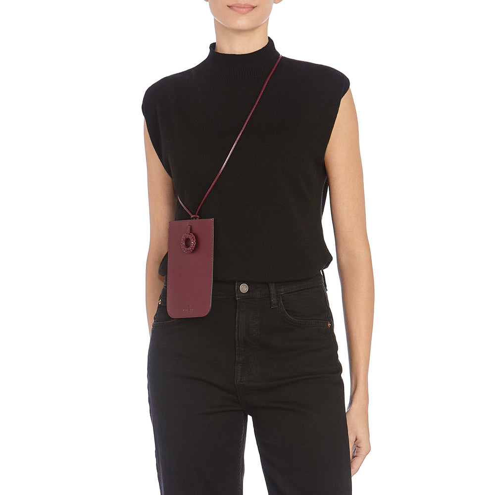 Tessa | Women's i-tech accessory in leather color black cherry — 
lifestyle view
 — 2 of 5