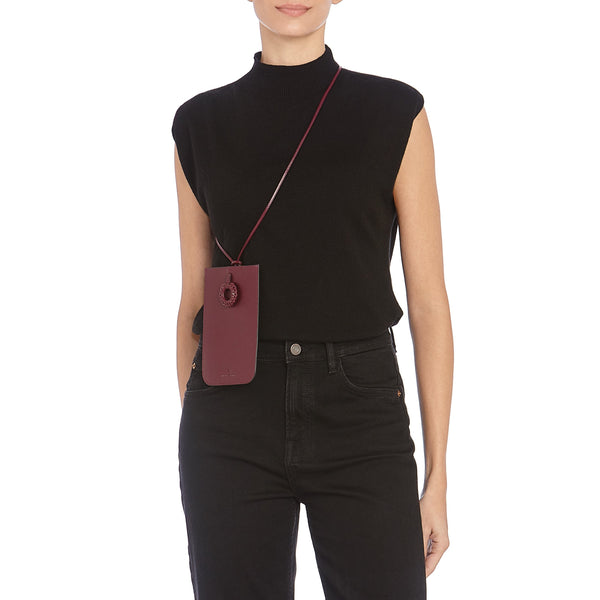 Tessa | Women's i-tech accessory in leather color black cherry — 
lifestyle view
