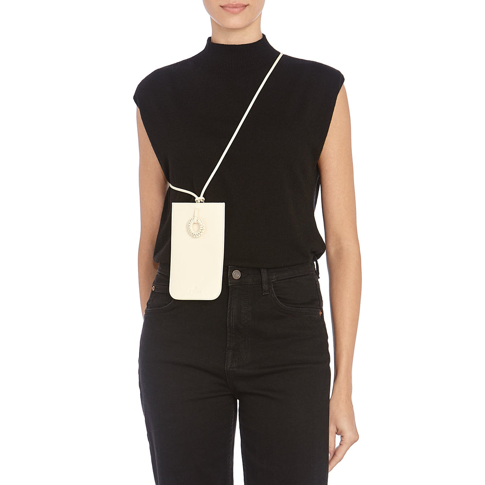 Tessa | Women's i-tech accessory in leather color milk — 
lifestyle view
 — 2 of 5
